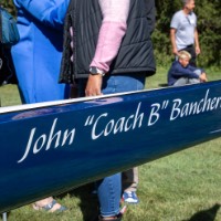 John "Coach B" Bancheri written on side of boat